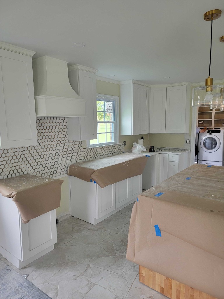Kitchen remodel with cabinets and tile backsplash