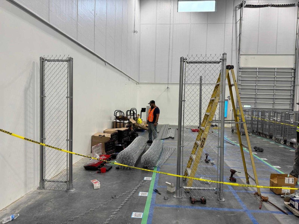 Warehouse safety fence installation in progress